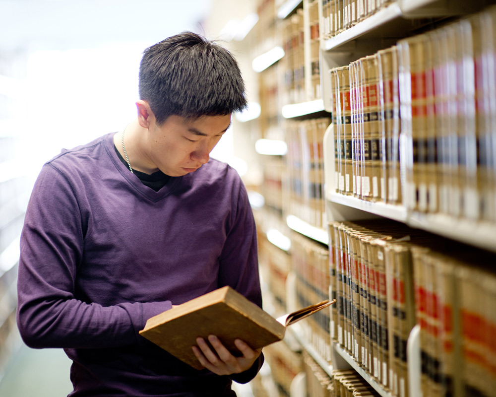 International student studying in law library