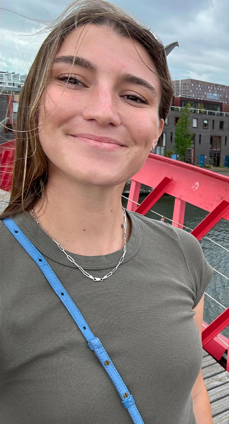 a female law student smiles for a selfie while abroad
